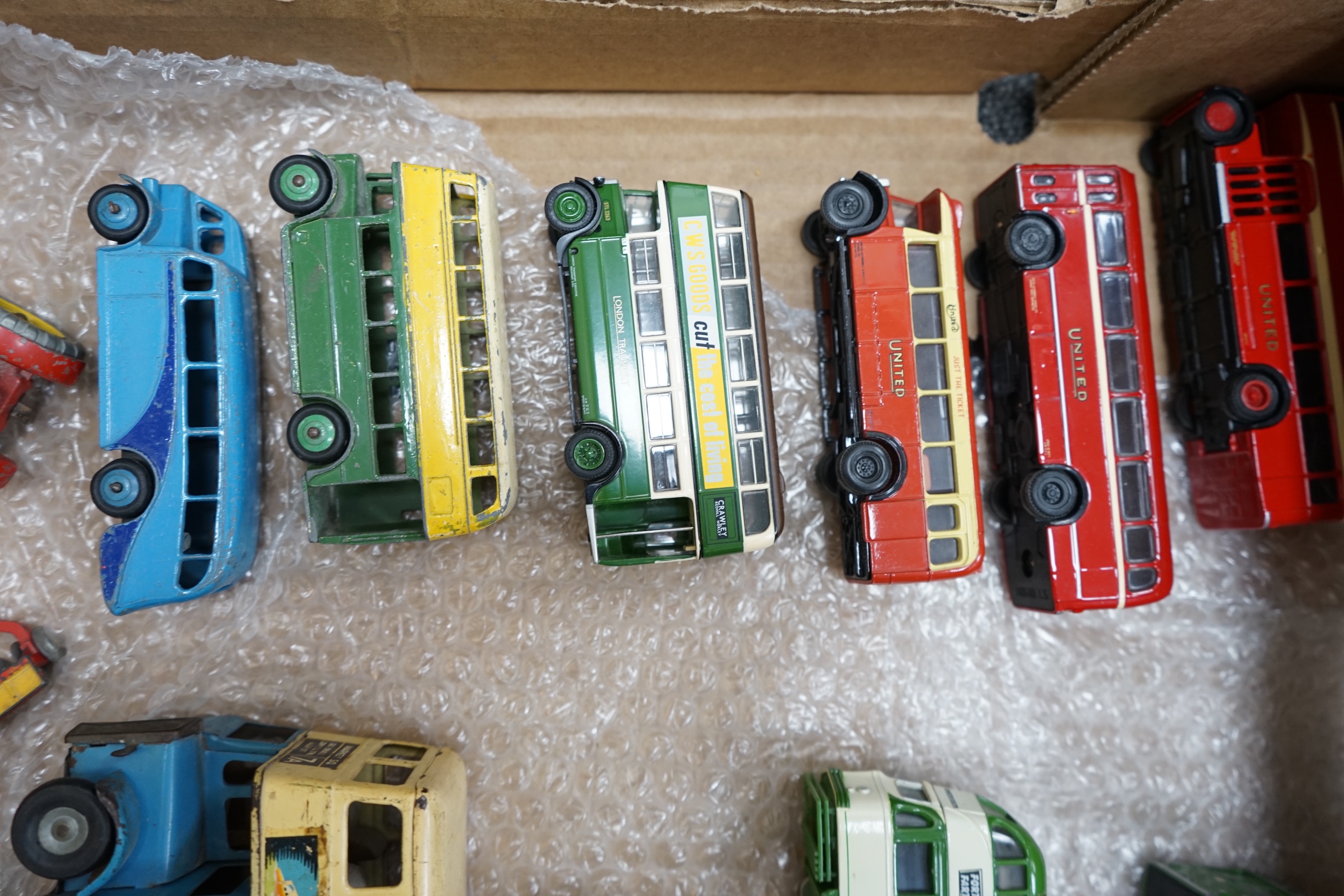 Sixteen models of buses and other vehicles by Dinky Toys, Corgi OOC, EFE, Concept Models etc. including a Tri-ang Minic clockwork tinplate double deck bus, an empty box for a Dinky Coventry Climax fork lift truck, etc. C